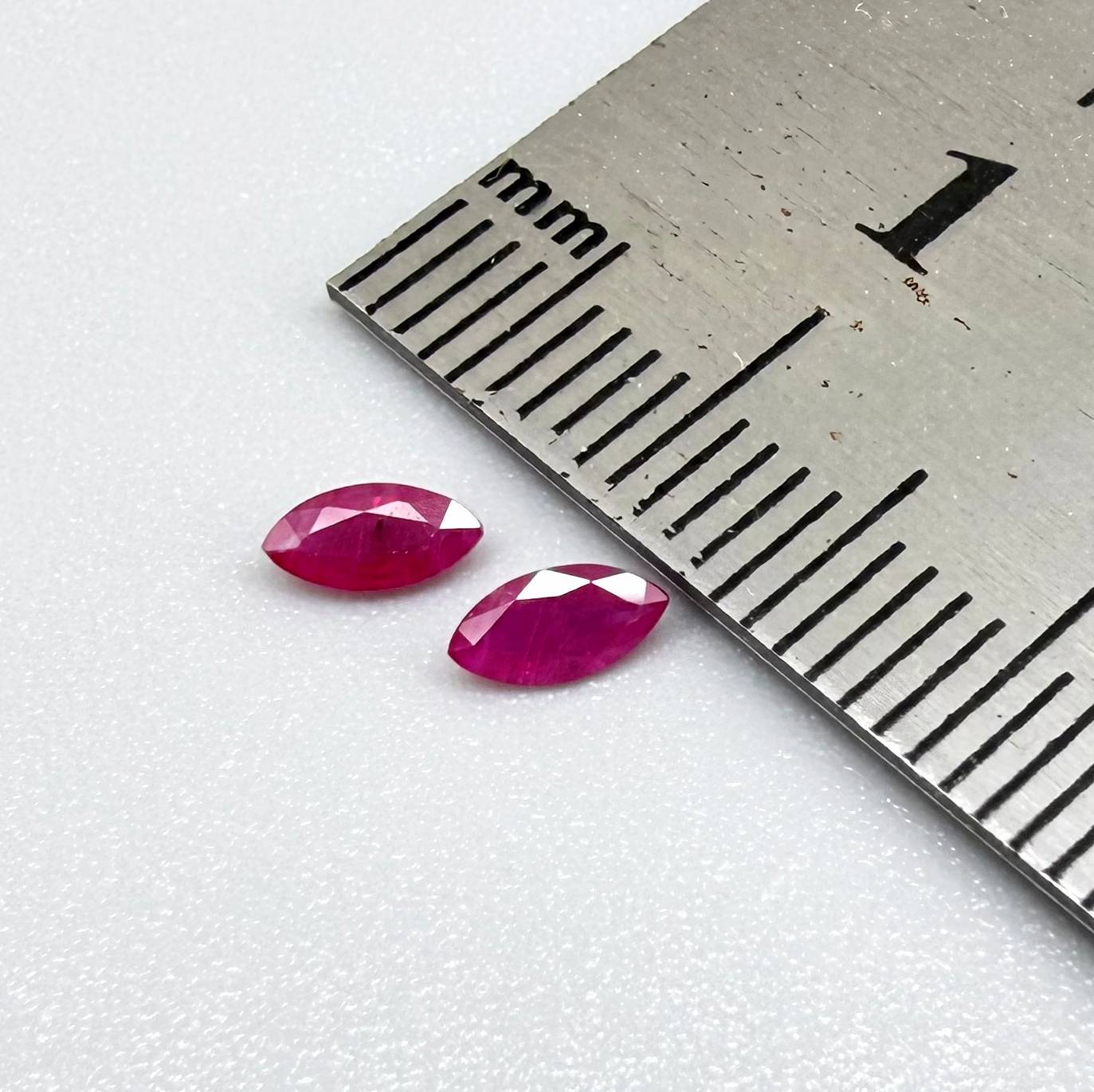 Faceted marquise-cut pink rubies with a total weight of 0.33 ct, eye-clean to slightly silky appearance with natural inclusions