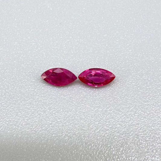 Two pink-red marquise-cut rubies with a total of 0.34 ct, eye-clean appearance with fine natural inclusions