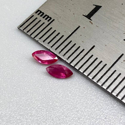 Two pink-red marquise-cut rubies with a total of 0.34 ct, eye-clean appearance with fine natural inclusions
