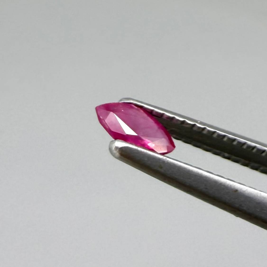 Two pink-red marquise-cut rubies with a total of 0.34 ct, eye-clean appearance with fine natural inclusions