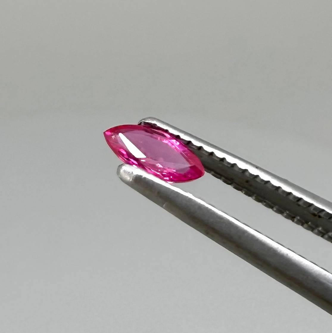 Two pink-red marquise-cut rubies with a total of 0.34 ct, eye-clean appearance with fine natural inclusions
