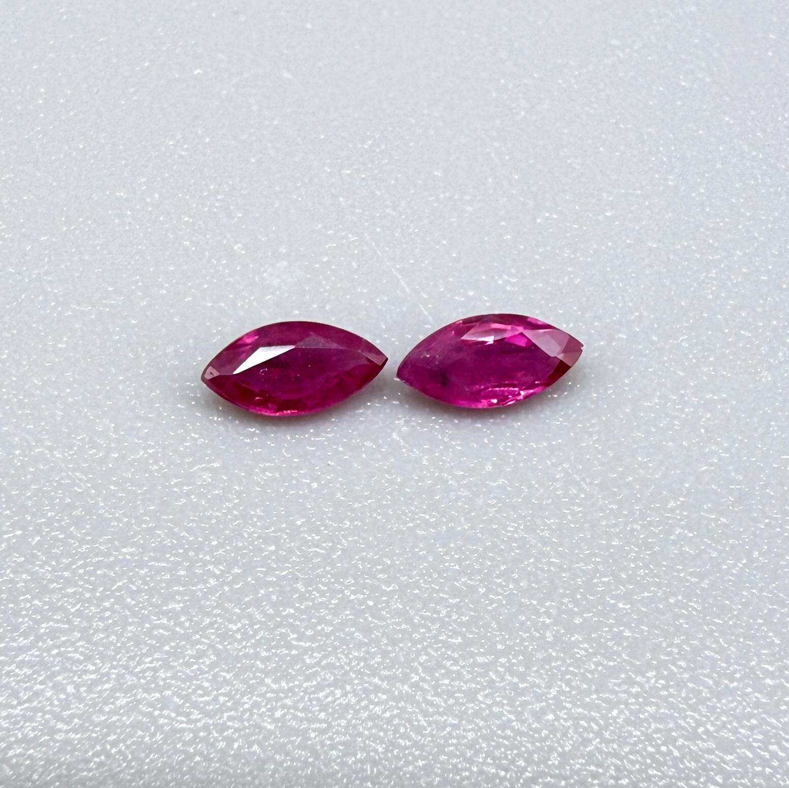 Two reddish-pink marquise-cut rubies, with a total of 0.33 ct, eye-clean appearance with fine natural inclusions