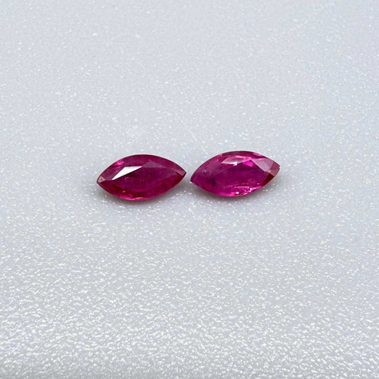 Two reddish-pink marquise-cut rubies, with a total of 0.33 ct, eye-clean appearance with fine natural inclusions