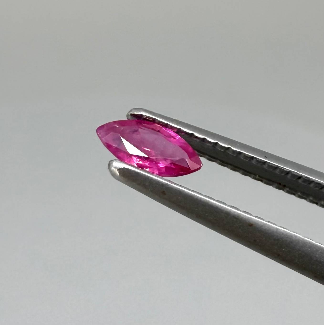Two reddish-pink marquise-cut rubies, with a total of 0.33 ct, eye-clean appearance with fine natural inclusions