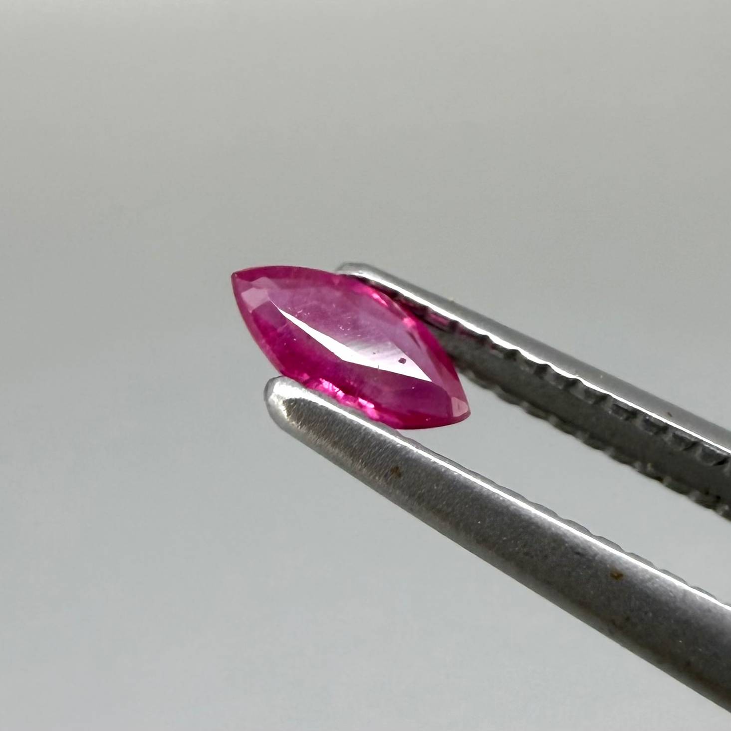 Two reddish-pink marquise-cut rubies, with a total of 0.33 ct, eye-clean appearance with fine natural inclusions
