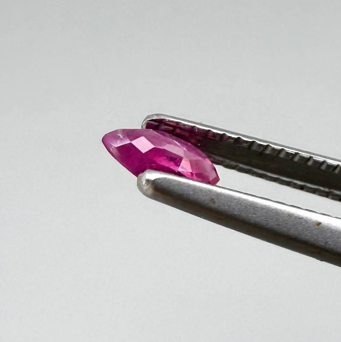 Two reddish-pink marquise-cut rubies, with a total of 0.33 ct, eye-clean appearance with fine natural inclusions