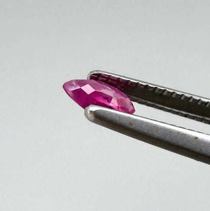 Two reddish-pink marquise-cut rubies, with a total of 0.33 ct, eye-clean appearance with fine natural inclusions