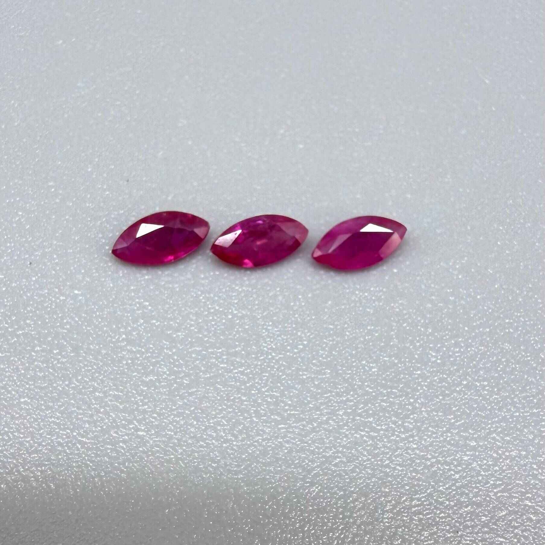 Three marquise-cut pink-red ruby, eye-clean to slightly silky appearance with fine inclusions
