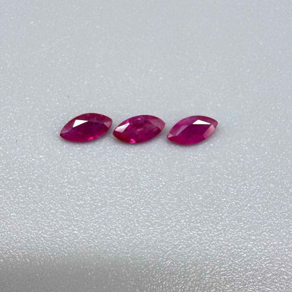 Three marquise-cut pink-red ruby, eye-clean to slightly silky appearance with fine inclusions