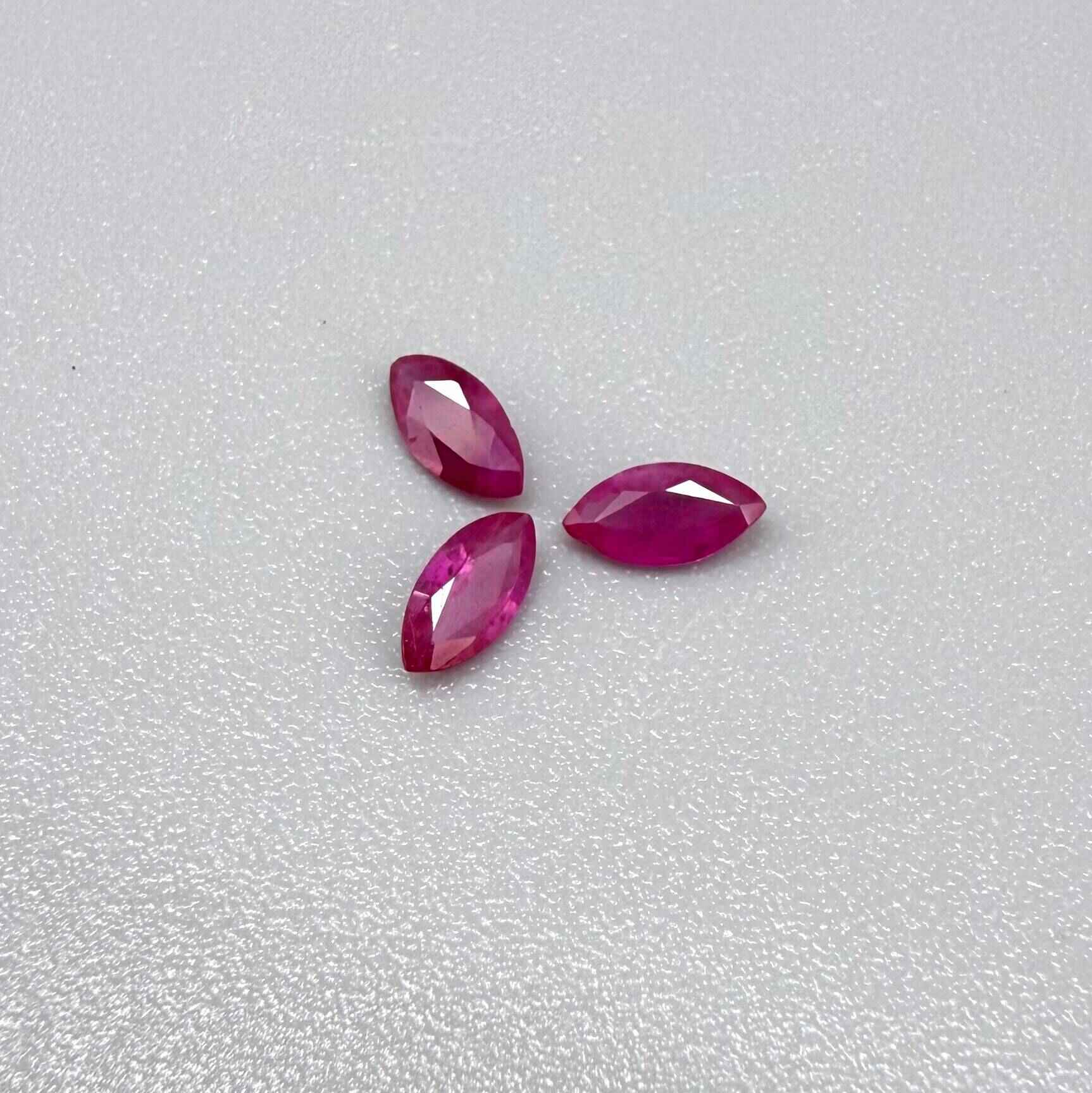 Three marquise-cut pink-red ruby, eye-clean to slightly silky appearance with fine inclusions