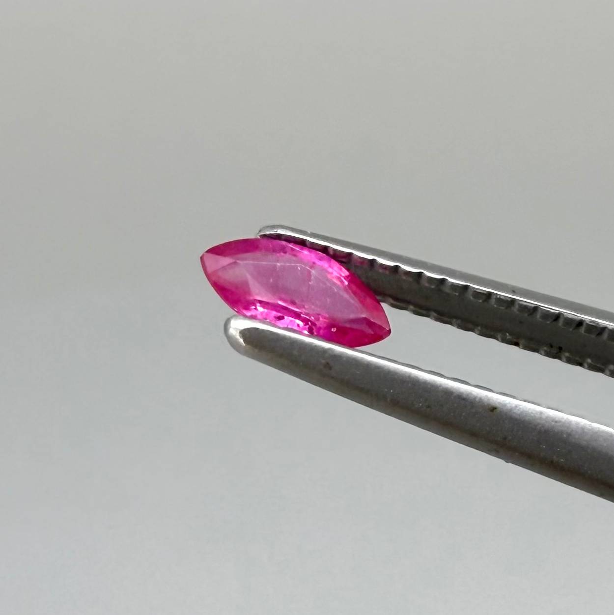 Three marquise-cut pink-red ruby, eye-clean to slightly silky appearance with fine inclusions