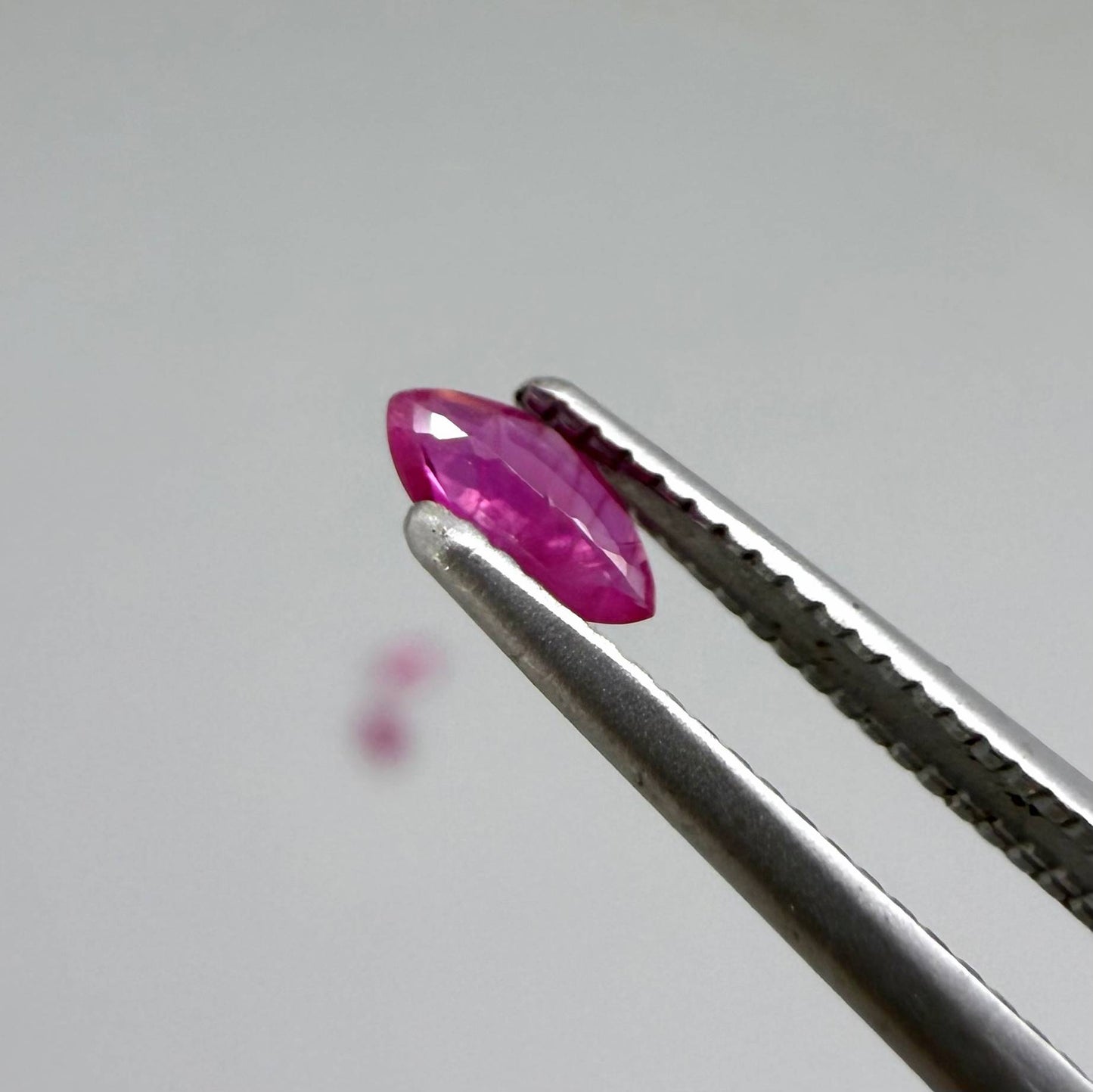 Three marquise-cut pink-red ruby, eye-clean to slightly silky appearance with fine inclusions