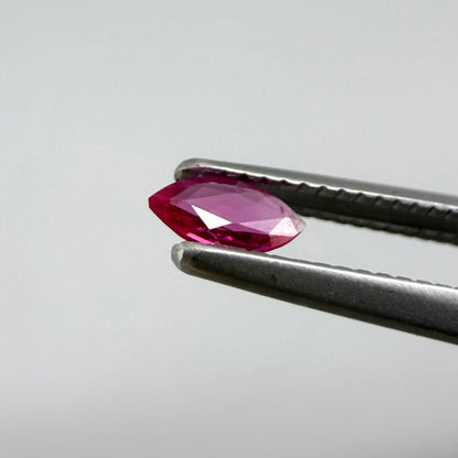 0.09 ct marquise-cut magenta-red ruby, eye-clean appearance with no visible inclusions with naked eye