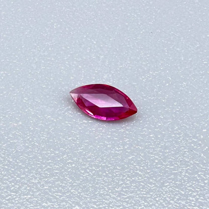 0.09 ct marquise-cut magenta-red ruby, eye-clean appearance with no visible inclusions with naked eye
