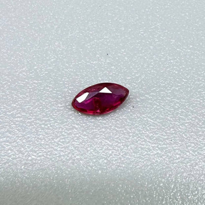 0.13 ct marquise-cut vivid pink-red ruby from Myanmar, eye-clean appearance