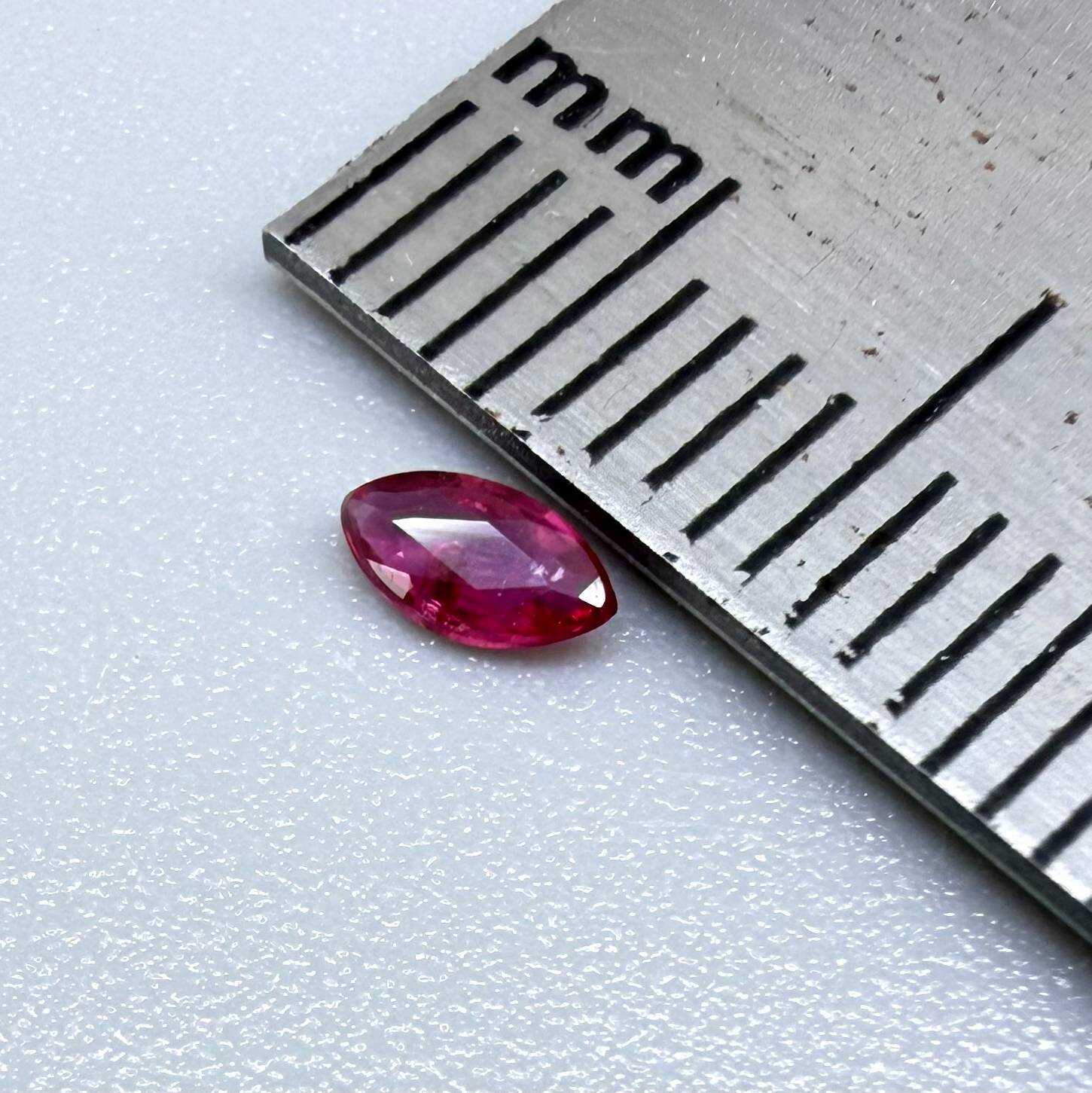 0.13 ct marquise-cut vivid pink-red ruby from Myanmar, eye-clean appearance