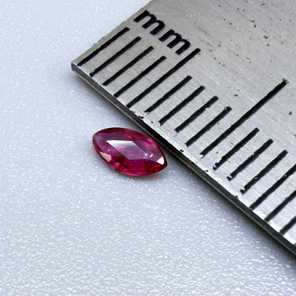 0.13 ct marquise-cut vivid pink-red ruby from Myanmar, eye-clean appearance