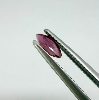 A marquise-cut deep pinkish-red ruby from Myanmar, 0.17 ct with eye-clean appearance and with fine natural inclusions