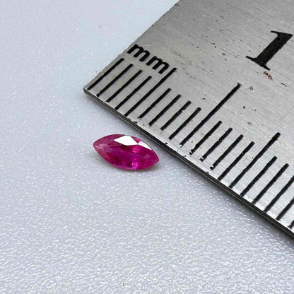 A small marquise-cut pink ruby from Myanmar, 0.16 ct, eye-clean appearance with fine natural inclusions