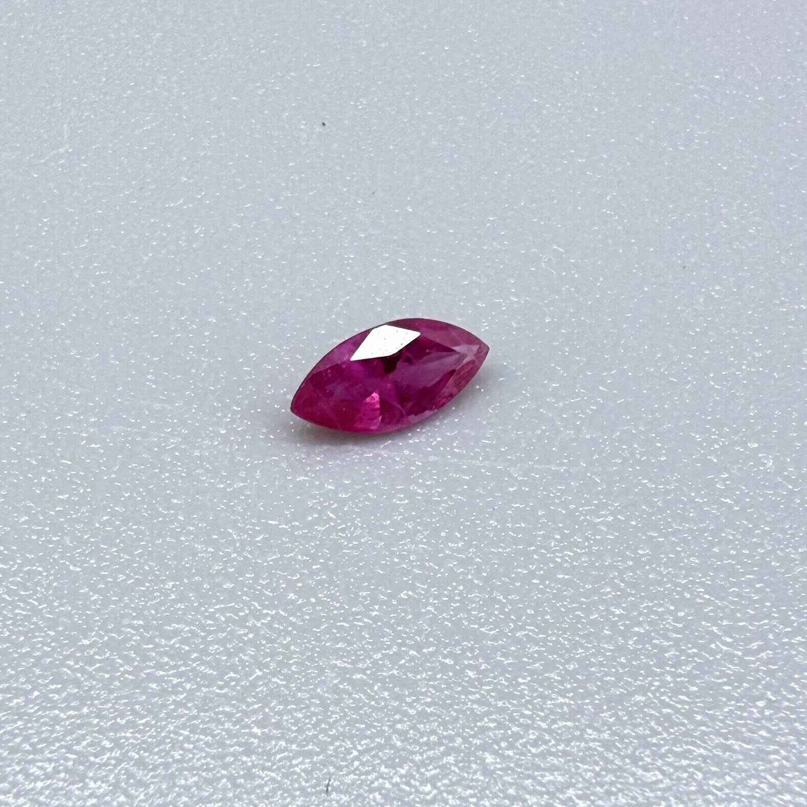 A small marquise-cut pink ruby from Myanmar, 0.16 ct, eye-clean appearance with fine natural inclusions