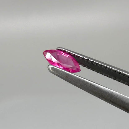 A small marquise-cut pink ruby from Myanmar, 0.16 ct, eye-clean appearance with fine natural inclusions
