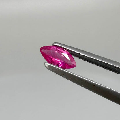 A small marquise-cut pink ruby from Myanmar, 0.16 ct, eye-clean appearance with fine natural inclusions
