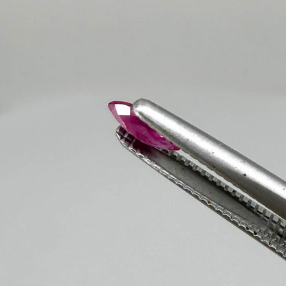 A small marquise-cut pink ruby from Myanmar, 0.16 ct, eye-clean appearance with fine natural inclusions