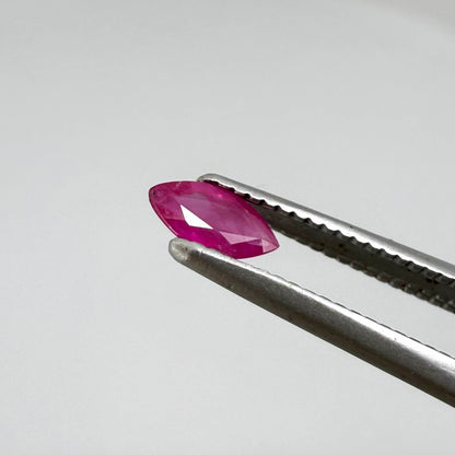 A faceted marquise-cut pink ruby from Myanmar, 0.16 ct, eye-clear to slightly silky appearance  with fine natural inclusions