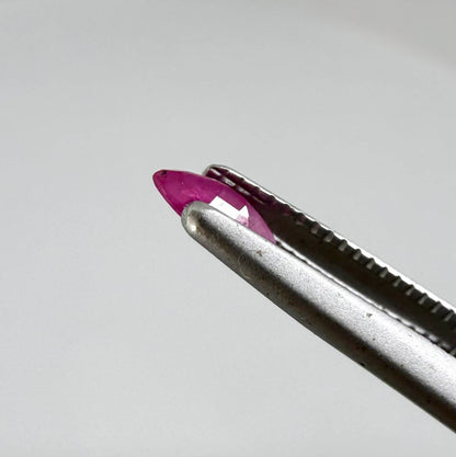 A faceted marquise-cut pink ruby from Myanmar, 0.16 ct, eye-clear to slightly silky appearance  with fine natural inclusions