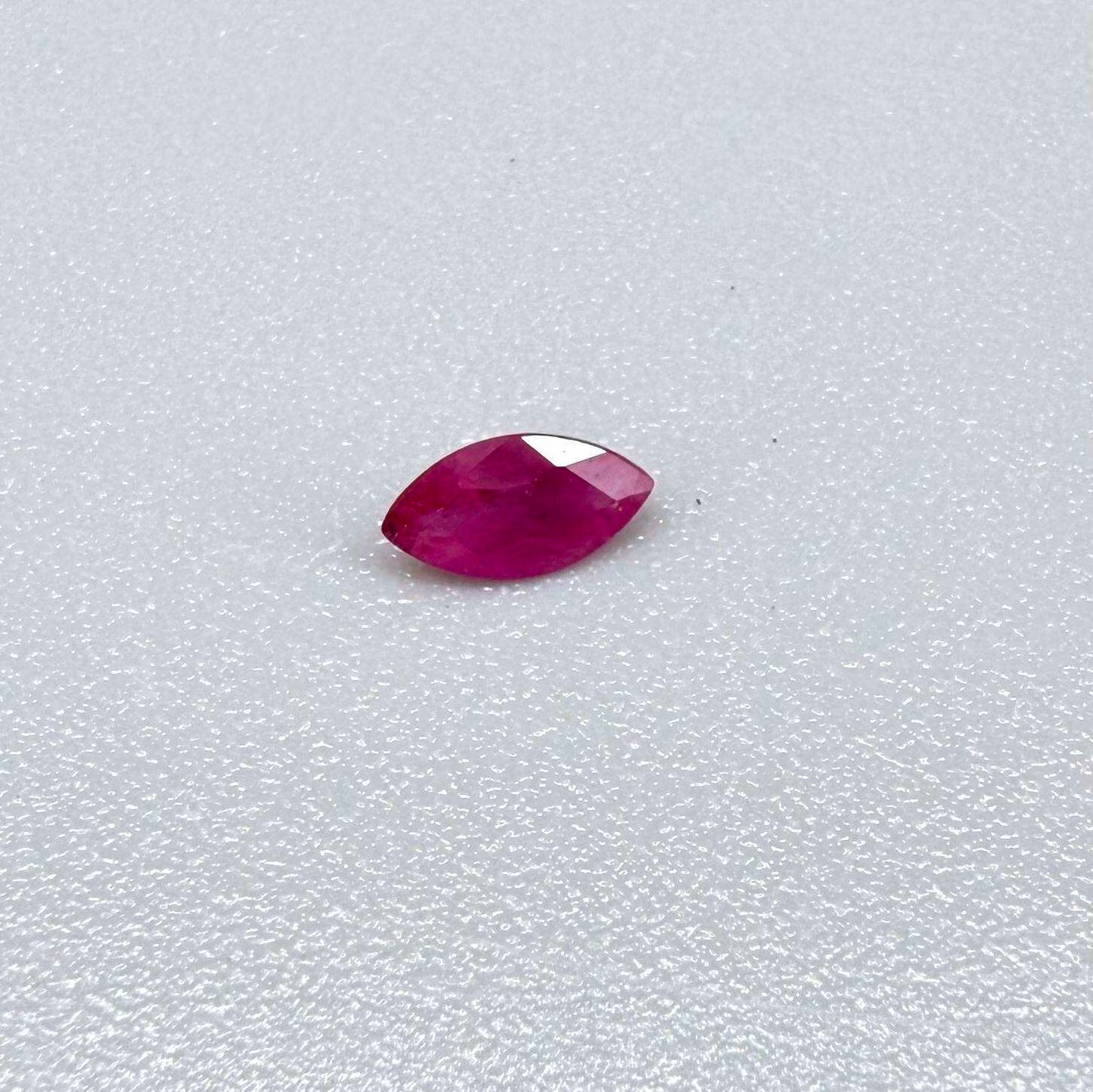 A faceted marquise-cut pink ruby from Myanmar, 0.16 ct, eye-clear to slightly silky appearance  with fine natural inclusions