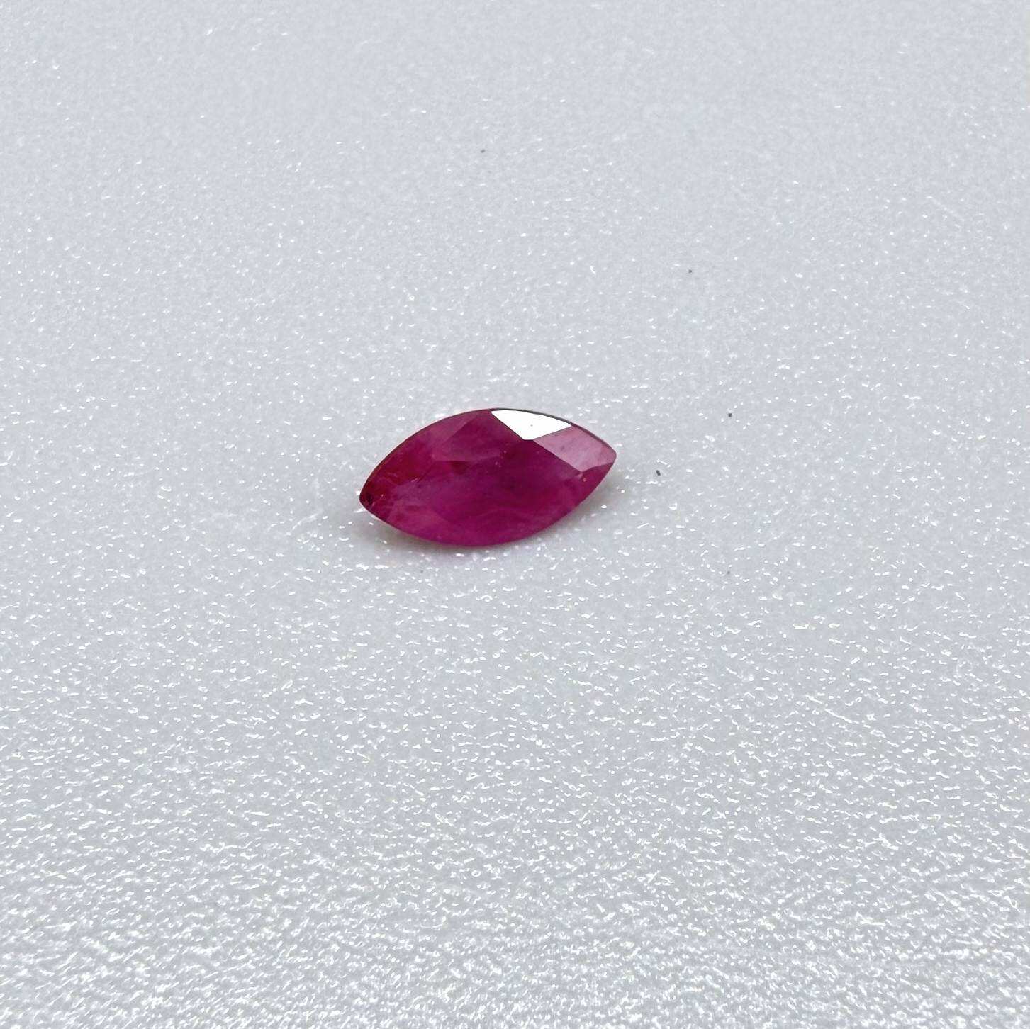 A faceted marquise-cut pink ruby from Myanmar, 0.16 ct, eye-clear to slightly silky appearance  with fine natural inclusions