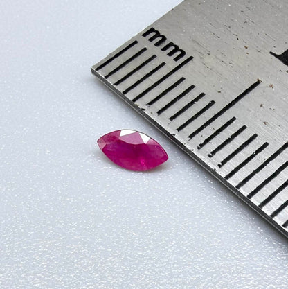A faceted marquise-cut pink ruby from Myanmar, 0.16 ct, eye-clear to slightly silky appearance  with fine natural inclusions