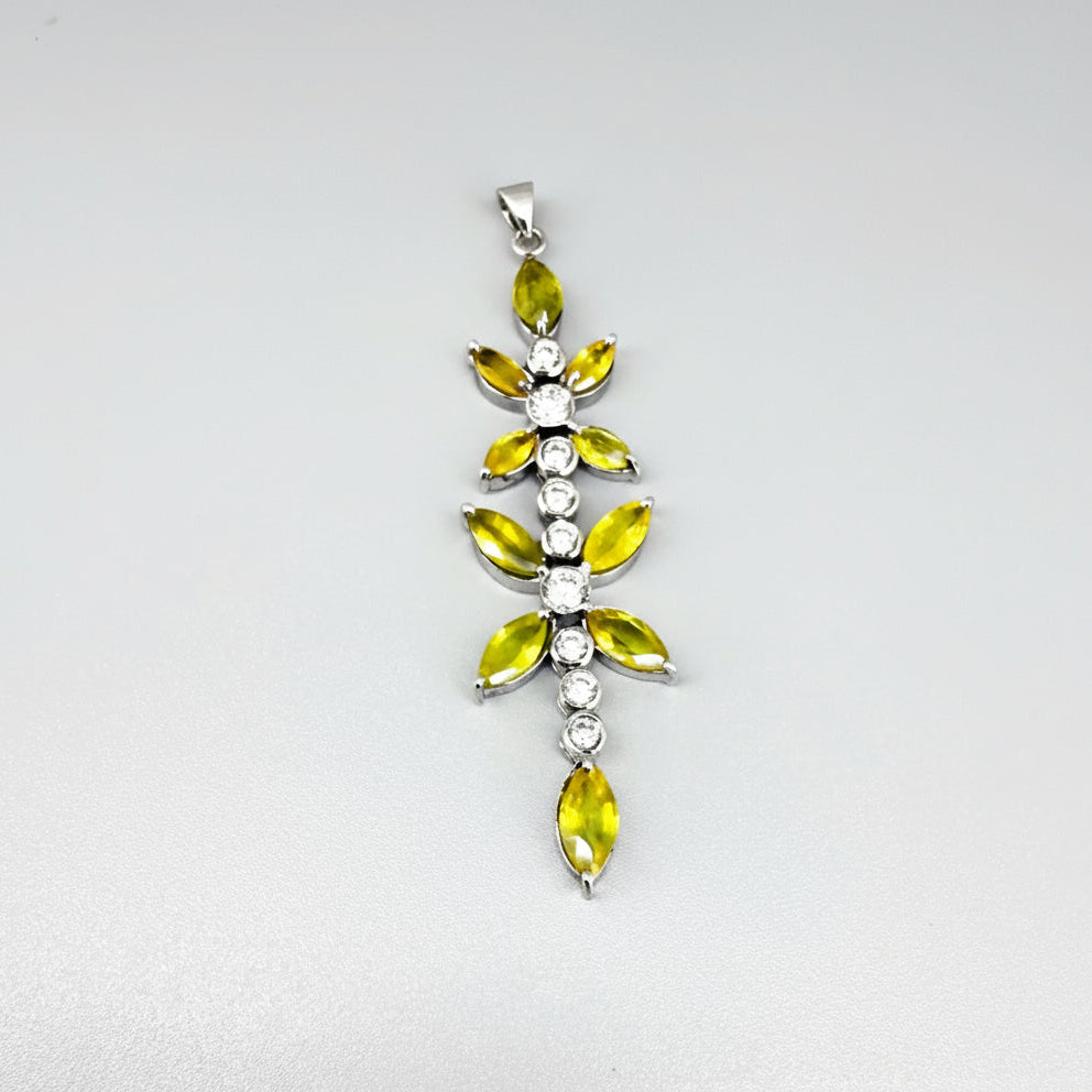 Handcrafted pendant with natural yellow sapphires (7.37 ct) and cubic zirconia in white-gold-plated silver leaf design, shown with matching earrings.