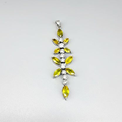 Handcrafted pendant with natural yellow sapphires (7.37 ct) and cubic zirconia in white-gold-plated silver leaf design, shown with matching earrings.