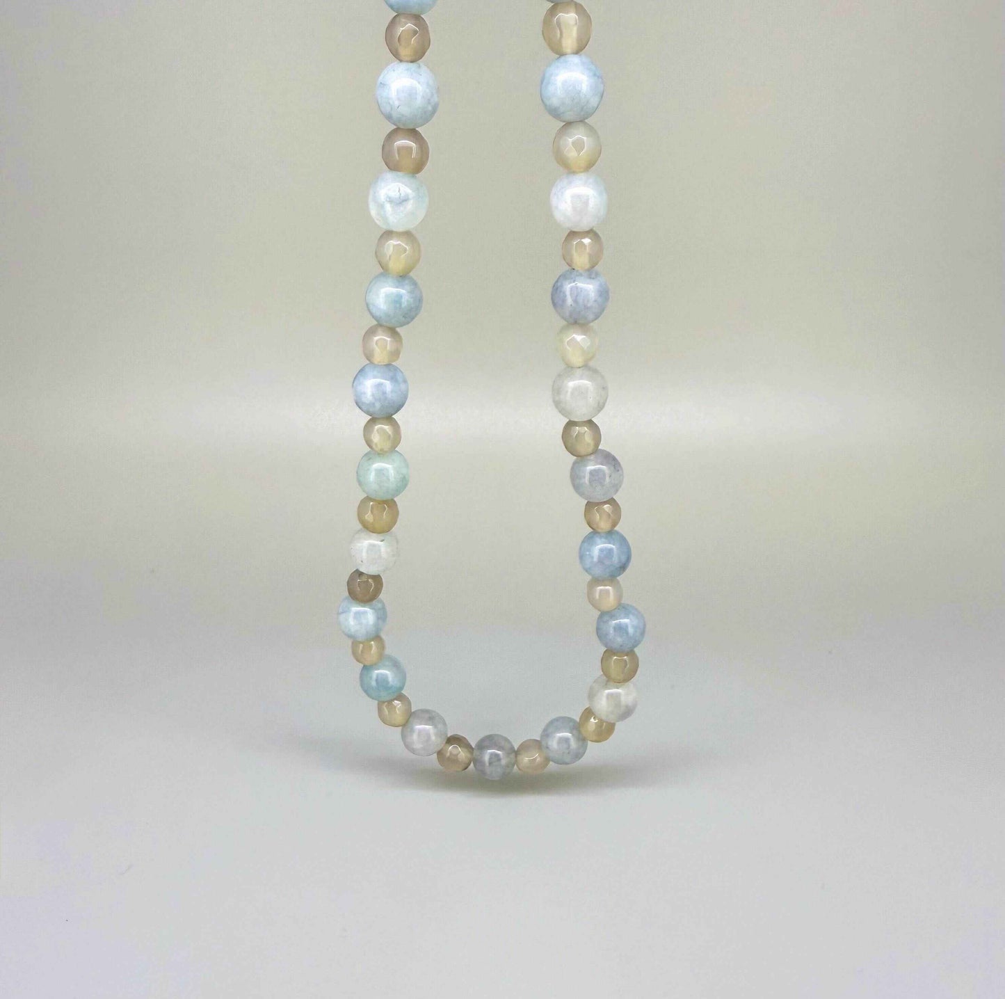 Handcrafted 43 cm agate beaded necklace in soft blue, beige, and cream tones, featuring a mix of matte and polished round beads.