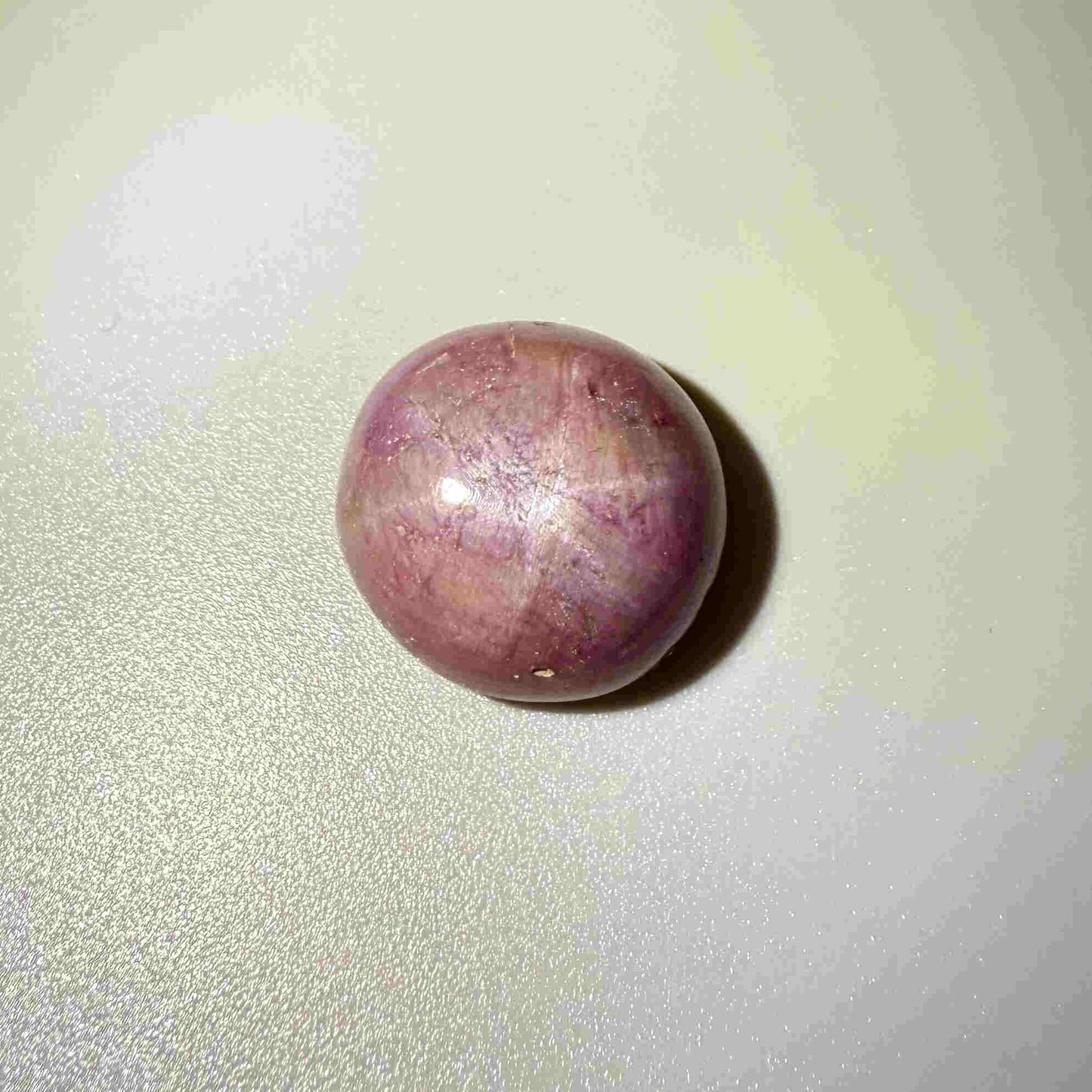 54.77 ct natural purplish-red Star Ruby cabochon from Madagascar with soft star effect and polished dome
