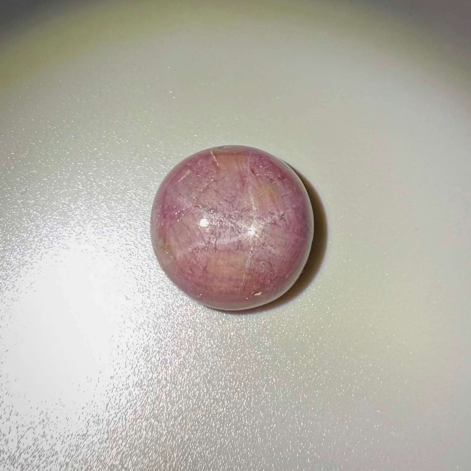 54.77 ct natural purplish-red Star Ruby cabochon from Madagascar with soft star effect and polished dome