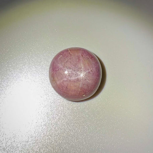 54.77 ct natural purplish-red Star Ruby cabochon from Madagascar with soft star effect and polished dome