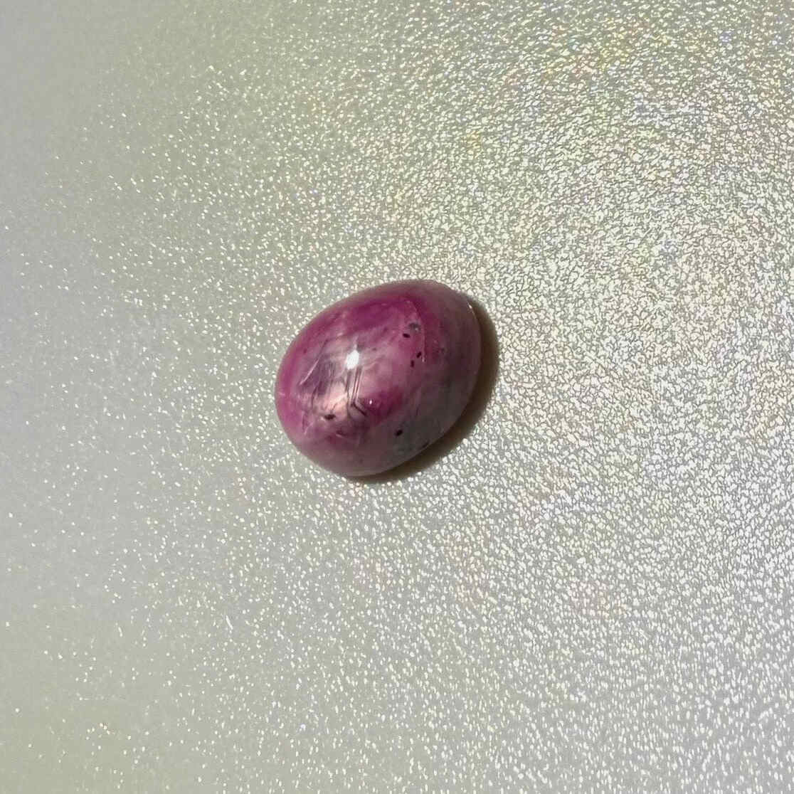 1.16 ct natural pink Star Ruby cabochon from Madagascar with soft star effect and polished dome.