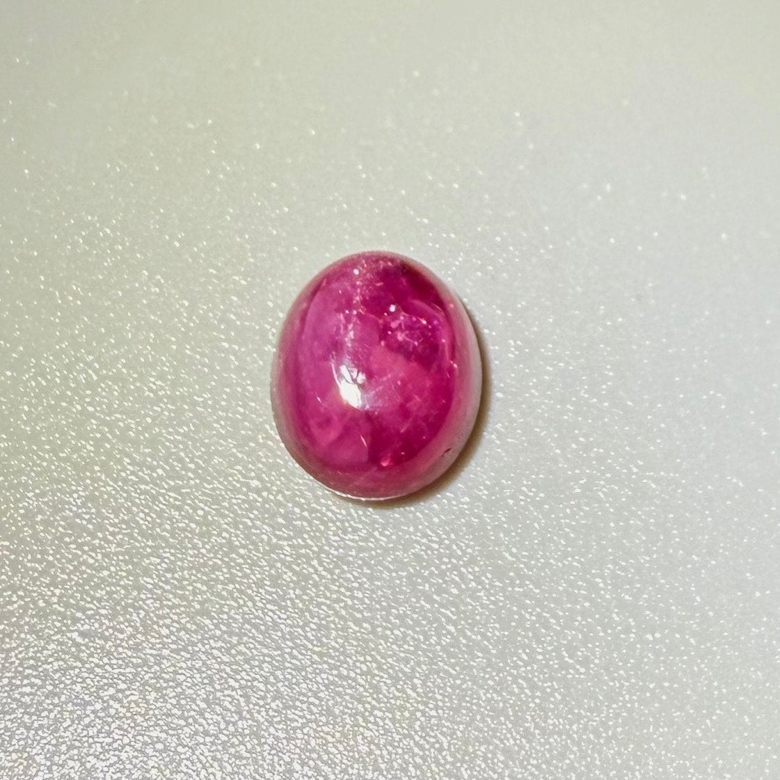 4.62 ct natural pink Star Ruby cabochon from Madagascar with soft star effect and polished dome.