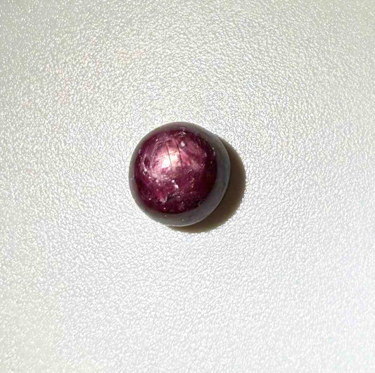 3.82 ct natural bordeaux-red Star Ruby cabochon with soft star effect and polished dome.
