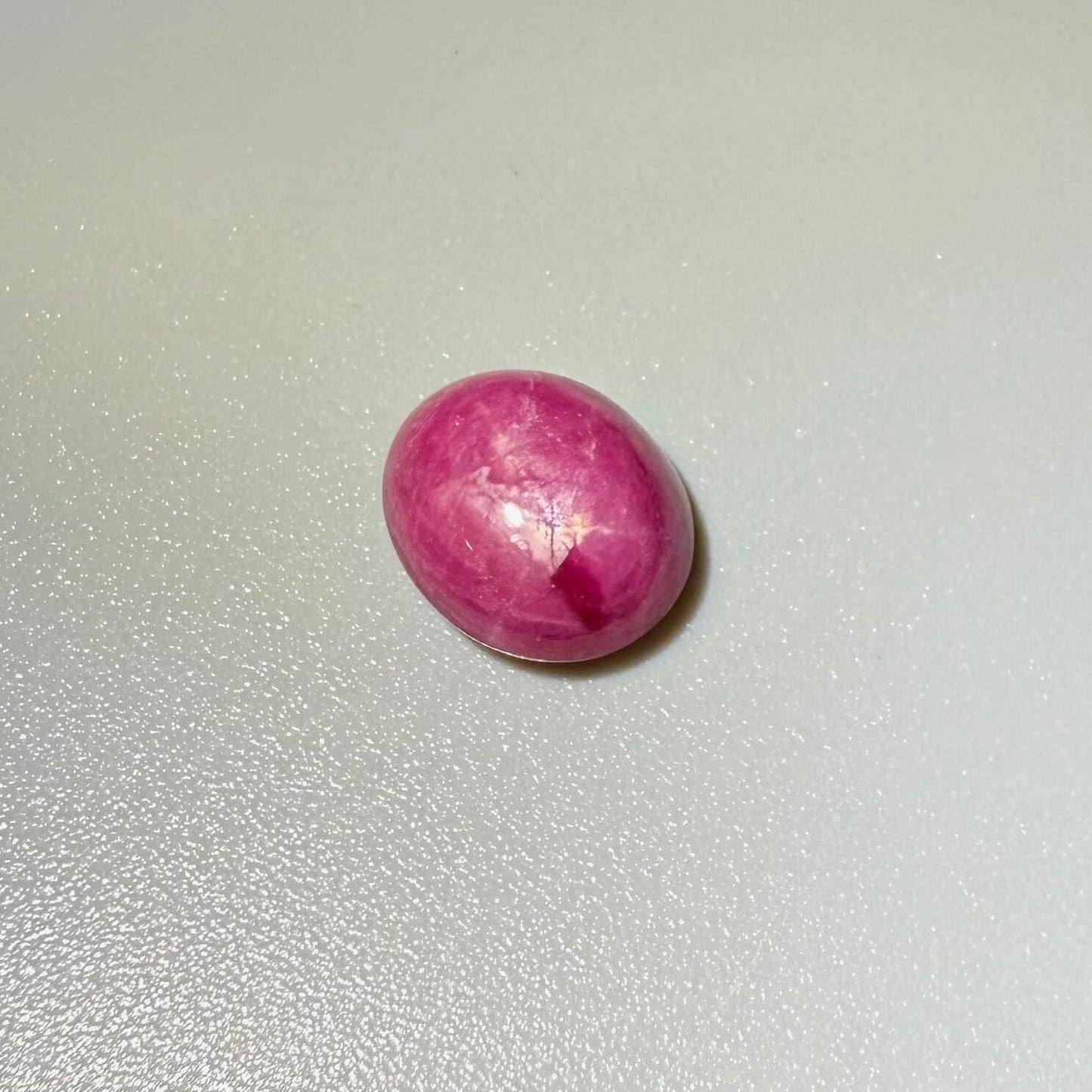 4.61 ct natural pink Star Ruby cabochon with soft star effect and polished dome.