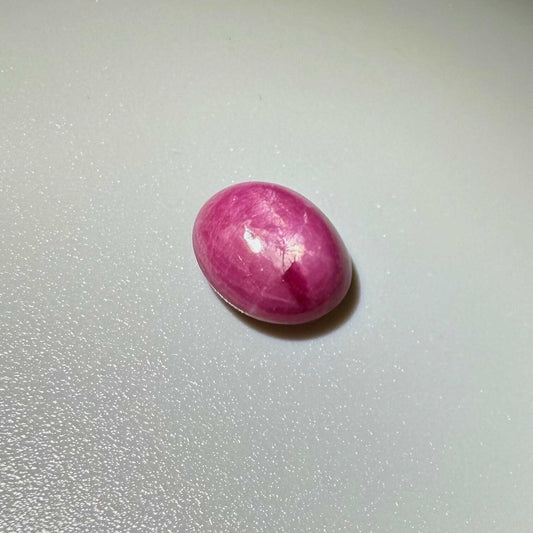 4.61 ct natural pink Star Ruby cabochon with soft star effect and polished dome.