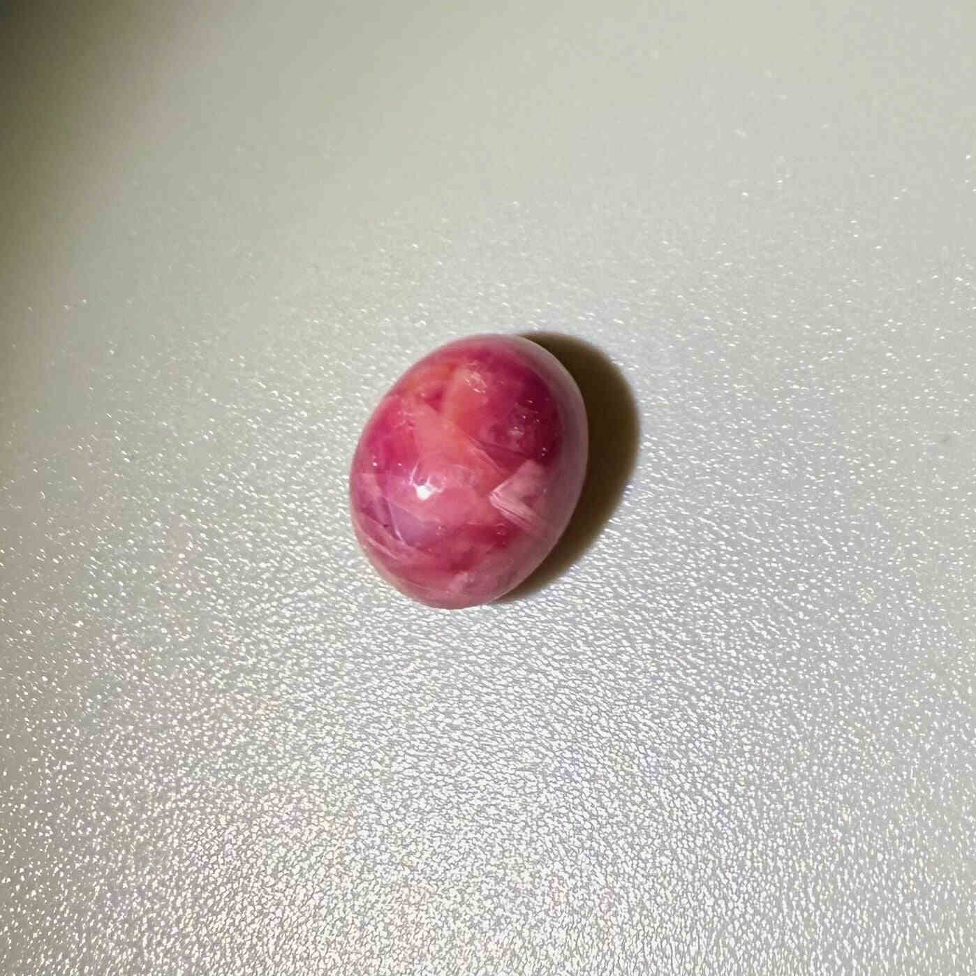 6.36 ct natural pink Star Ruby cabochon with soft star effect and polished dome.