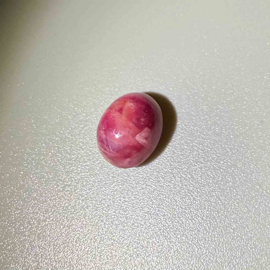 6.36 ct natural pink Star Ruby cabochon with soft star effect and polished dome.