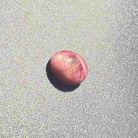 3.13 ct natural pinkish-red Star Ruby cabochon with soft star effect and polished dome.