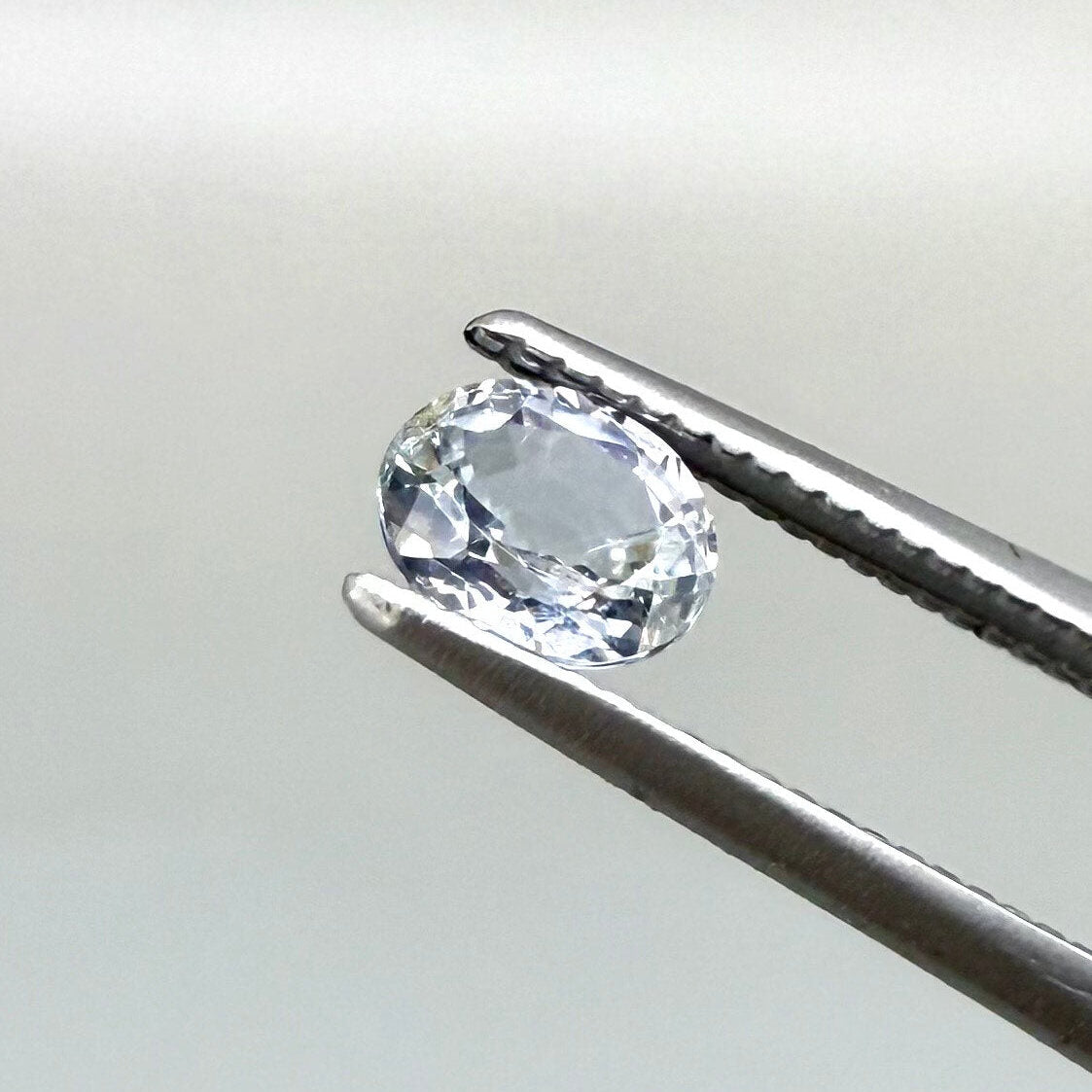 0.54 ct natural pale purplish-blue sapphire, oval cut.