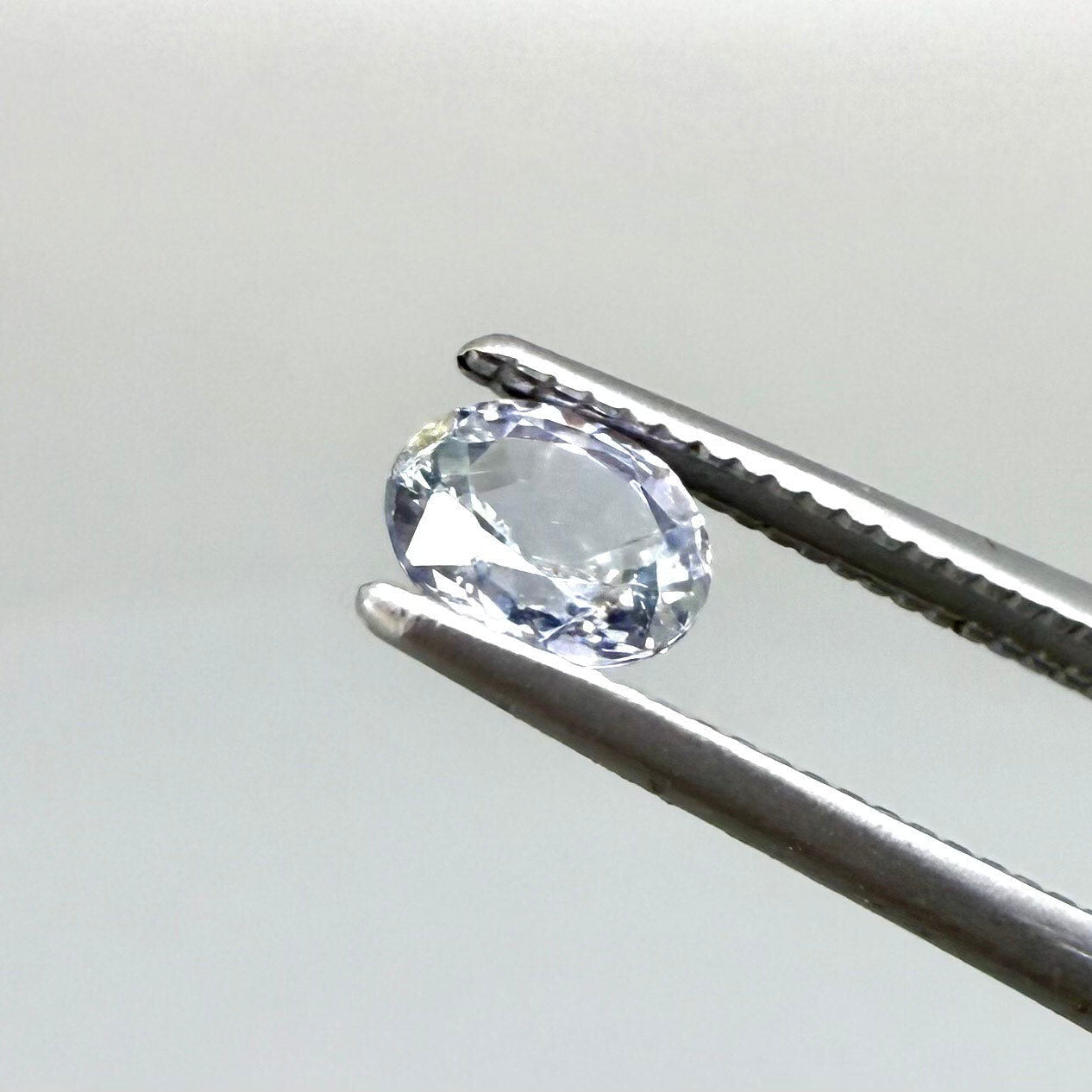 0.54 ct natural pale purplish-blue sapphire, oval cut.