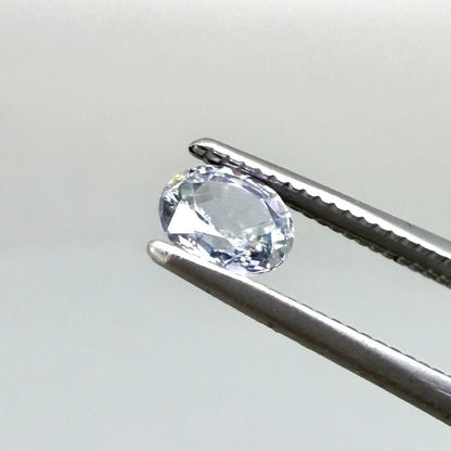 0.54 ct natural pale purplish-blue sapphire, oval cut.