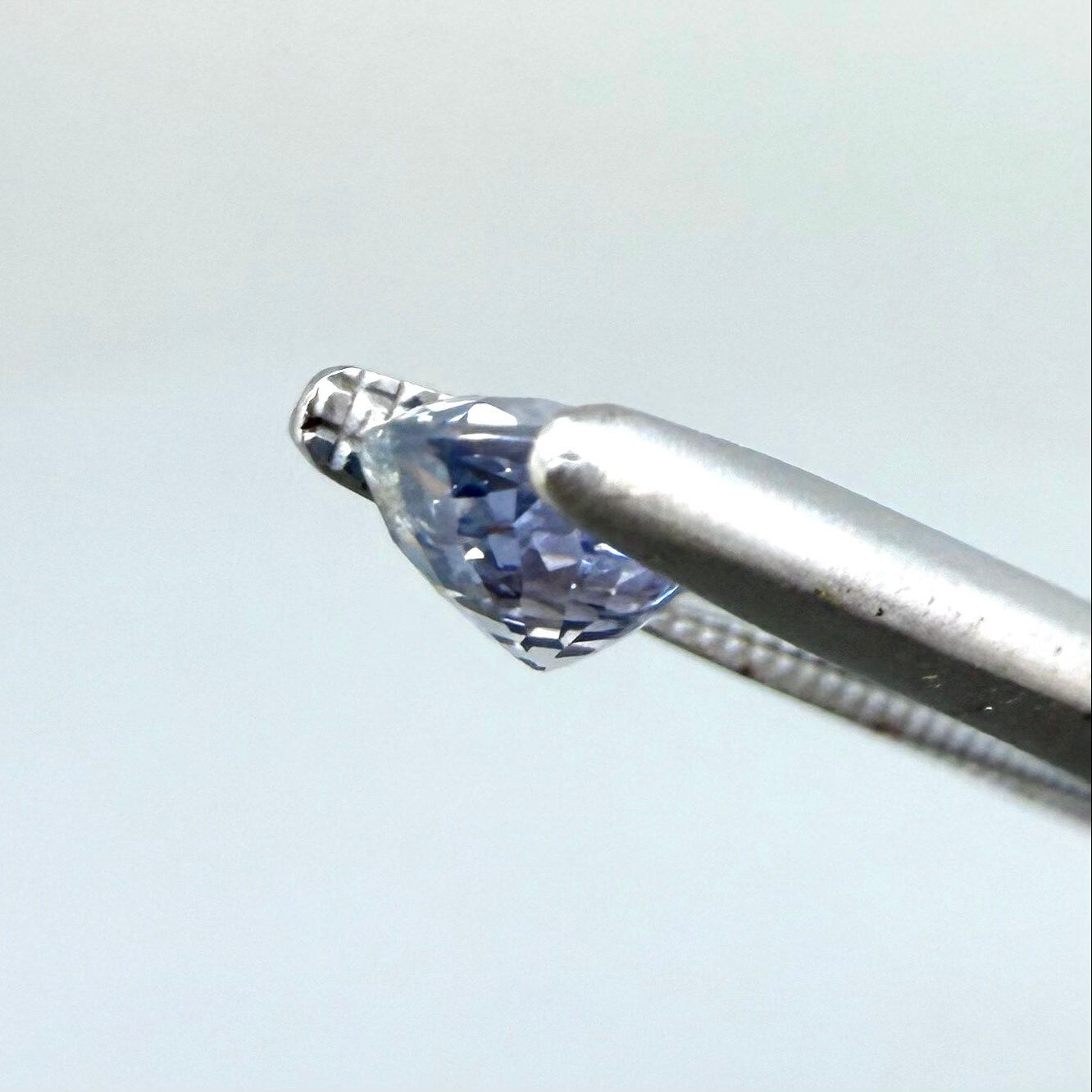 0.54 ct natural pale purplish-blue sapphire, oval cut.